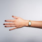 Reloj ovalo dorado
