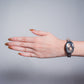 Reloj ovalo plata tacto piel cafe